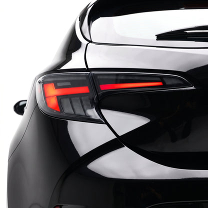 Toyota Corolla E210 Hatch (2019 - 2024) Black LED Sequential Tail Lights LH + RH installed close-up