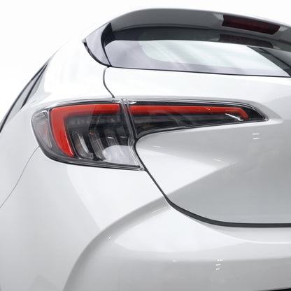 Toyota Corolla E210 Hatch (2019 - 2024) Smoked White LED Sequential Tail Lights LH + RH installed close-up
