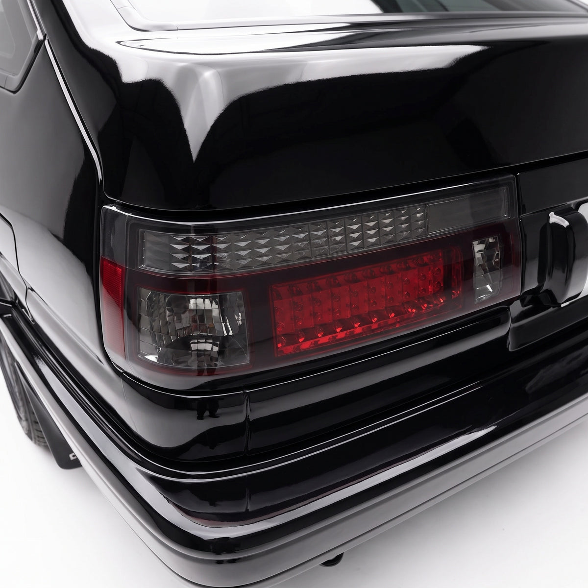 Toyota Corolla E80 / AE86 (1983 - 1987) Smoked Red LED Tail Lights LH + RH installed close-up