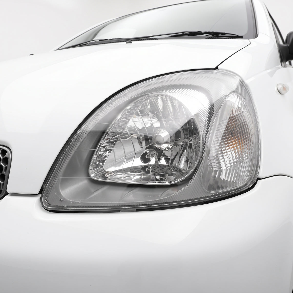 Toyota Echo NCP (1999 - 2002) OEM Style Headlights LH + RH installed close-up