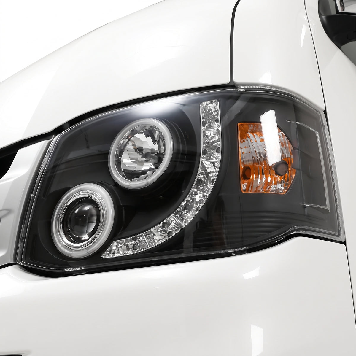 Toyota HiAce H200 (2011 - 2014) CCFL Angel-Eyes LED DRL Projector Headlights LH + RH installed close-up