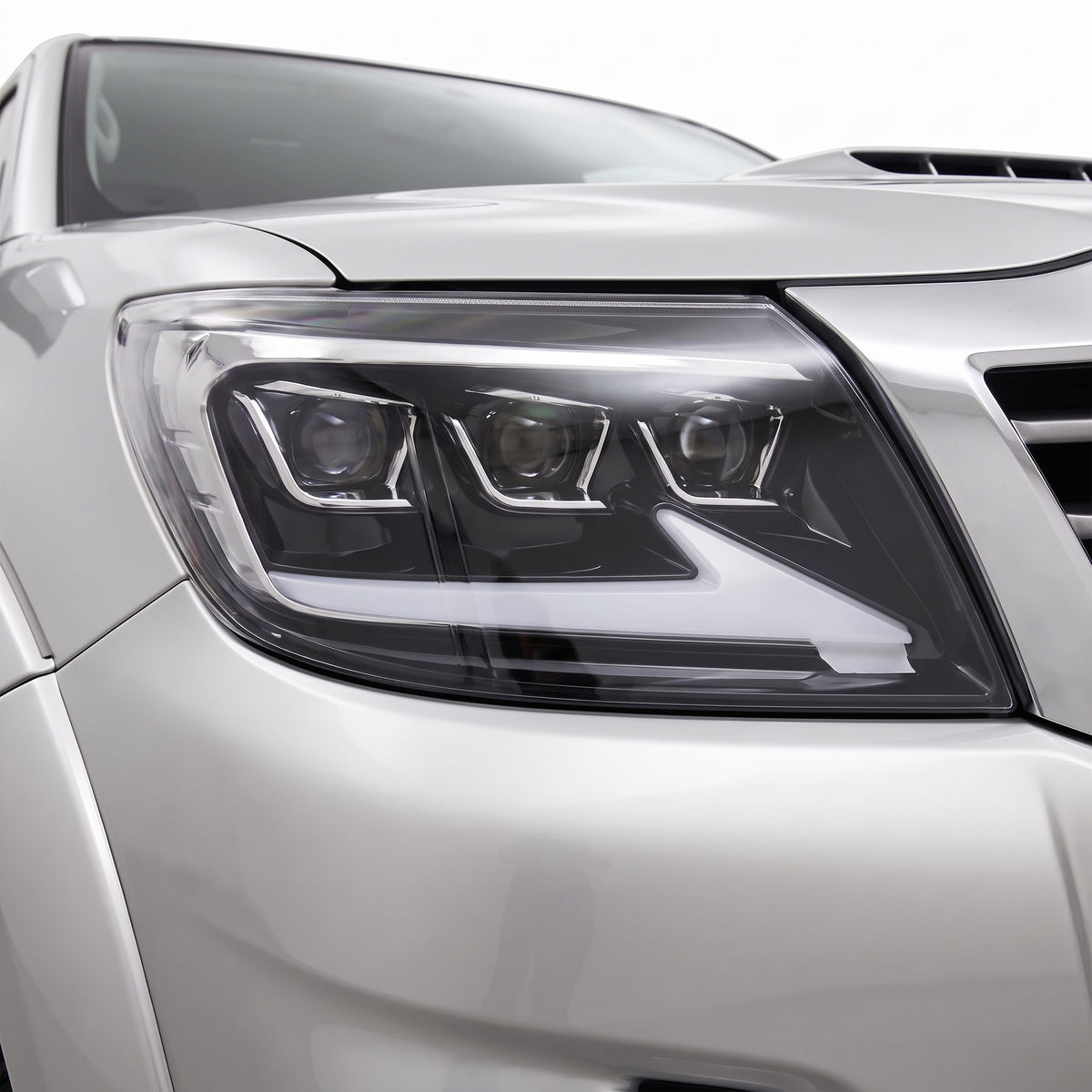 Toyota HiLux N70 Facelift (2011 - 2015) Triple Lens LED DRL Headlights LH + RH installed close-up