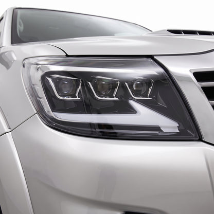 Toyota HiLux N70 Facelift (2011 - 2015) Triple Lens LED DRL Headlights LH + RH installed close-up