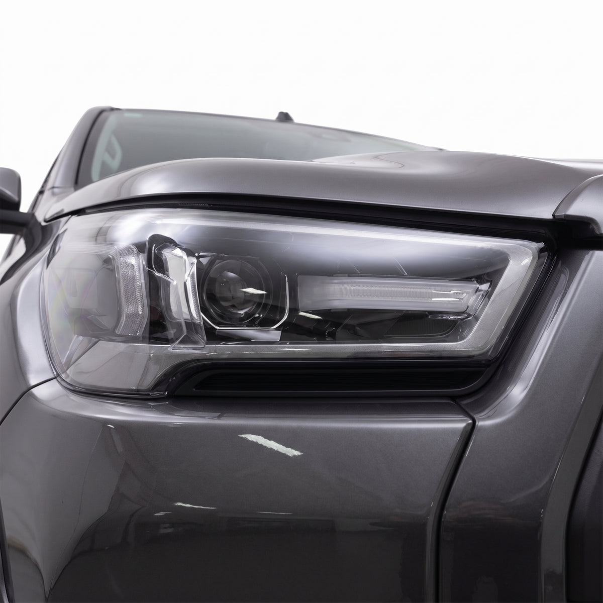 Toyota HiLux N80 (2021 - 2026) DRL LED Projector Headlights LH + RH installed close-up