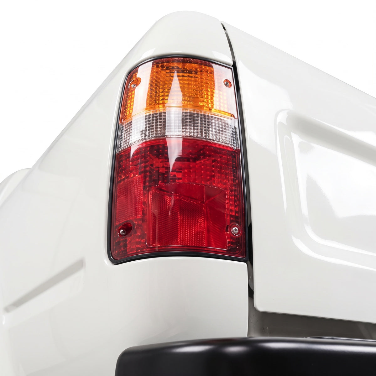 Toyota Hilux N50 (1988 - 1997) OEM Style Tail Lights LH + RH installed close-up
