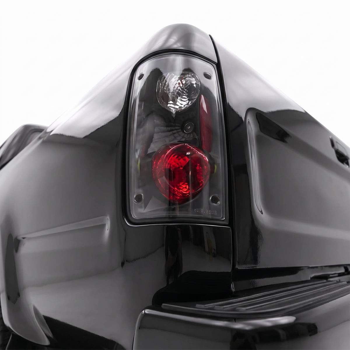 Toyota Hilux N50 (1989 - 1997) JDM Style Black Altezza Tail Lights LH + RH installed close-up
