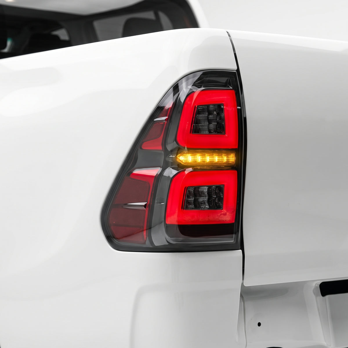 Toyota Hilux N80 (2015 - 2024) Sequential Smoked C-Style LED Tail Lights LH + RH installed