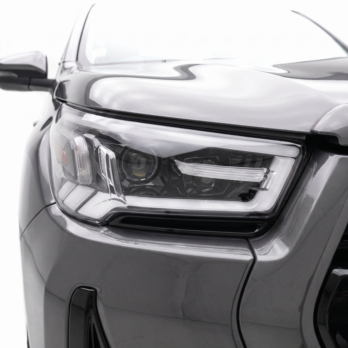 Toyota Hilux N80 (2020 - 2022) Sequential DRL Projector Headlights LH + RH installed close-up