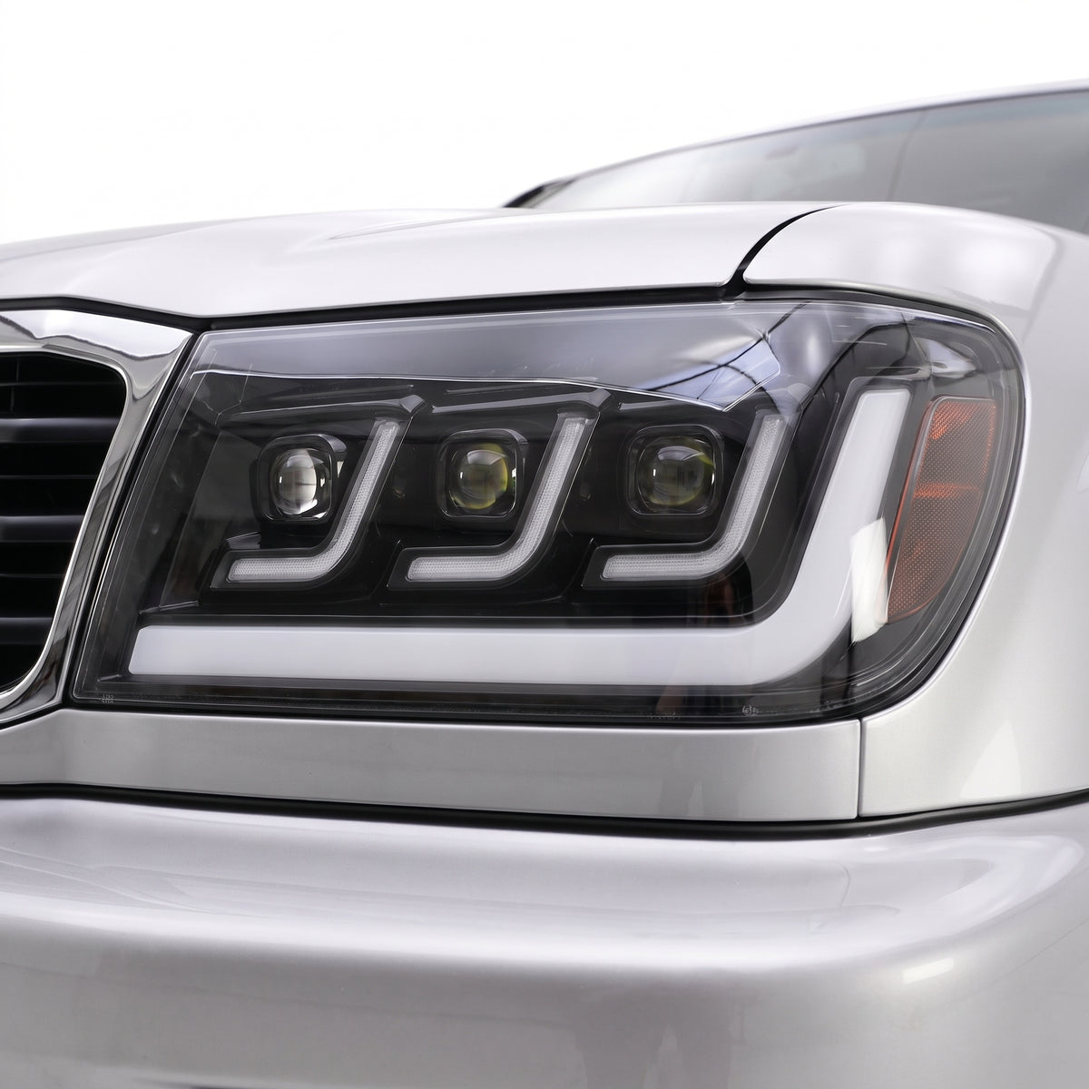 Toyota LandCruiser 100 Series (1998 - 2007) Full LED Triple Lens DRL Projector Headlights LH + RH installed close-up