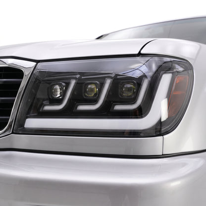 Toyota LandCruiser 100 Series (1998 - 2007) Full LED Triple Lens DRL Projector Headlights LH + RH installed close-up