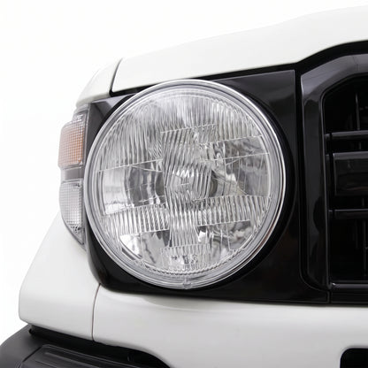 Toyota LandCruiser 70 / 73 / 75 / 78 / 79 Series (1985 - 2007) H4 7-inch Round OEM Style Headlights LH + RH installed close-up