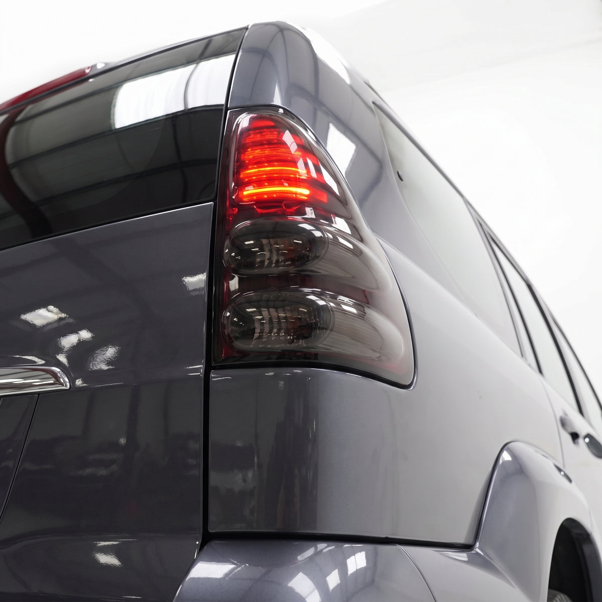Toyota LandCruiser Prado 120 Series (2003 - 2009) Smoked Black LED Tail Lights LH + RH installed close-up