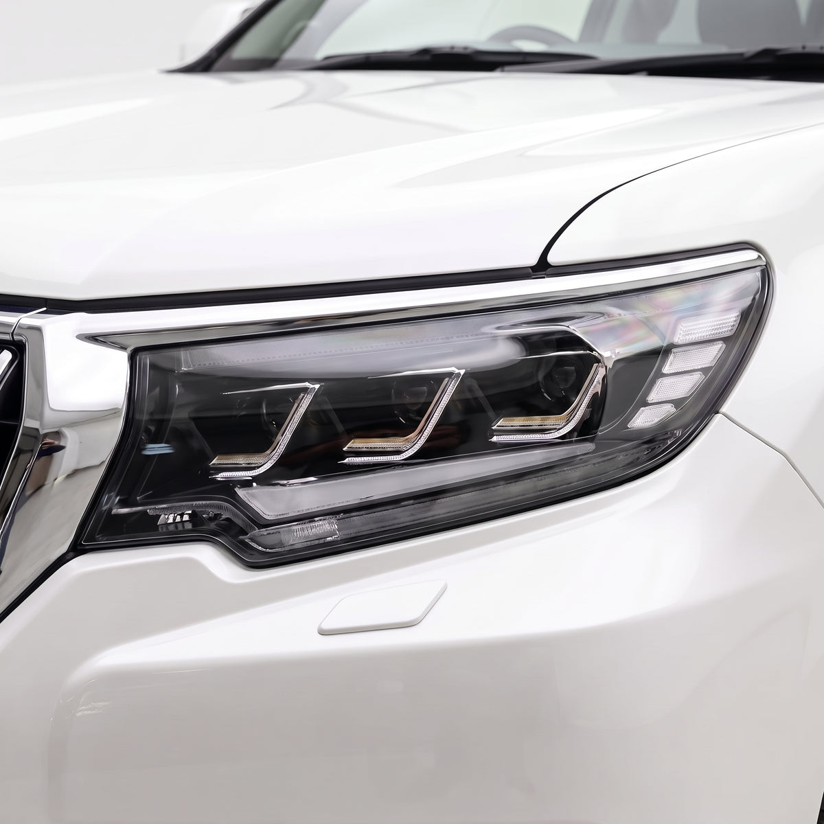 Toyota LandCruiser Prado 150 Series (2018- 2023) FULL LED DRL Sequential Projector Headlights LH + RH installed close-up