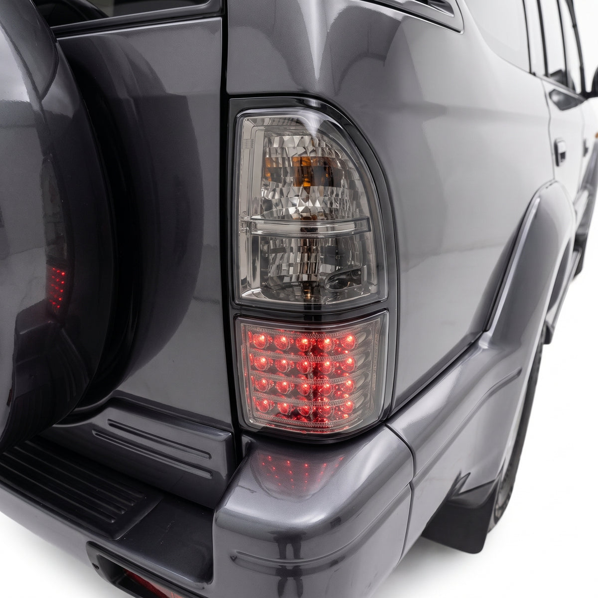 Toyota LandCruiser Prado 90 95 Series (1996 - 2002) PRESTIGE Series Smoked Tail Lights LH + RH installed close-up