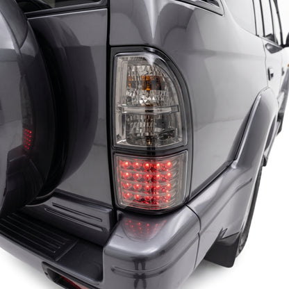 Toyota LandCruiser Prado 90 95 Series (1996 - 2002) PRESTIGE Series Smoked Tail Lights LH + RH installed close-up