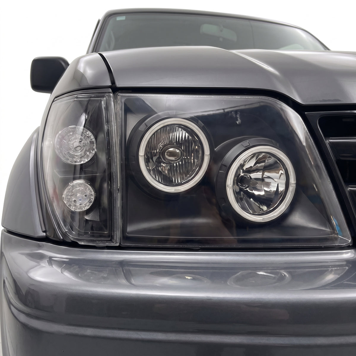 Toyota LandCruiser Prado 90 / 95 Series (1997 - 2002) Black Halo Angel Eyes Headlights LH + RH installed close-up