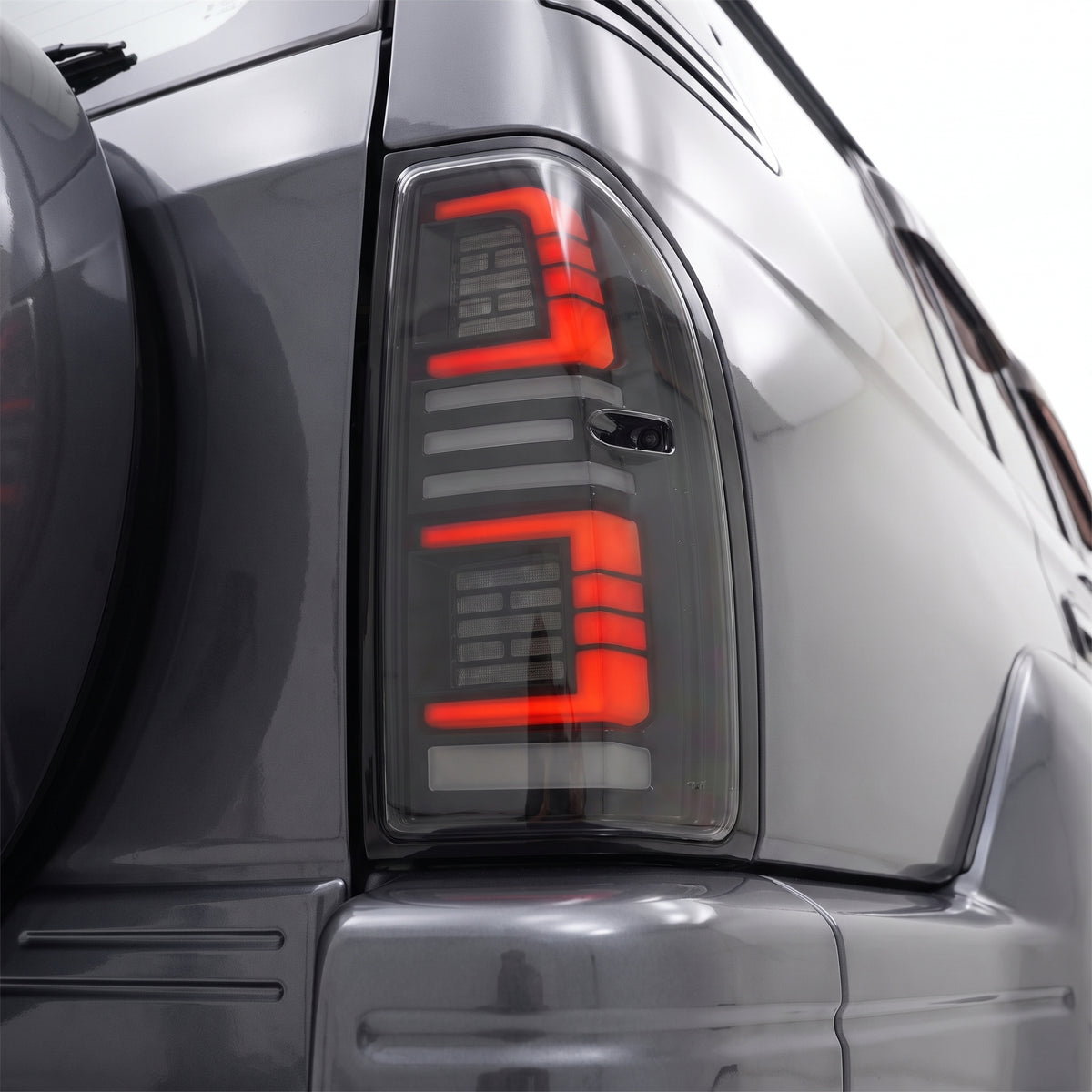 Toyota LandCruiser Prado 90 / 95 Series (1997 - 2002) Smoked Sequential Full LED Tail Lights LH + RH installed close-up