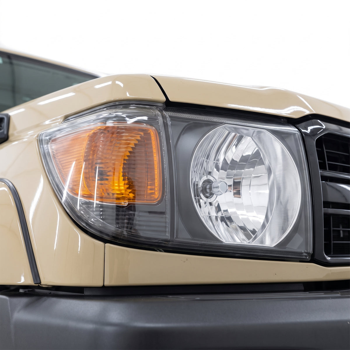 Toyota LandCruiser VDJ 70 / 76 / 78 / 79 Series (2007 - 2019) Black Headlights LH + RH installed close-up